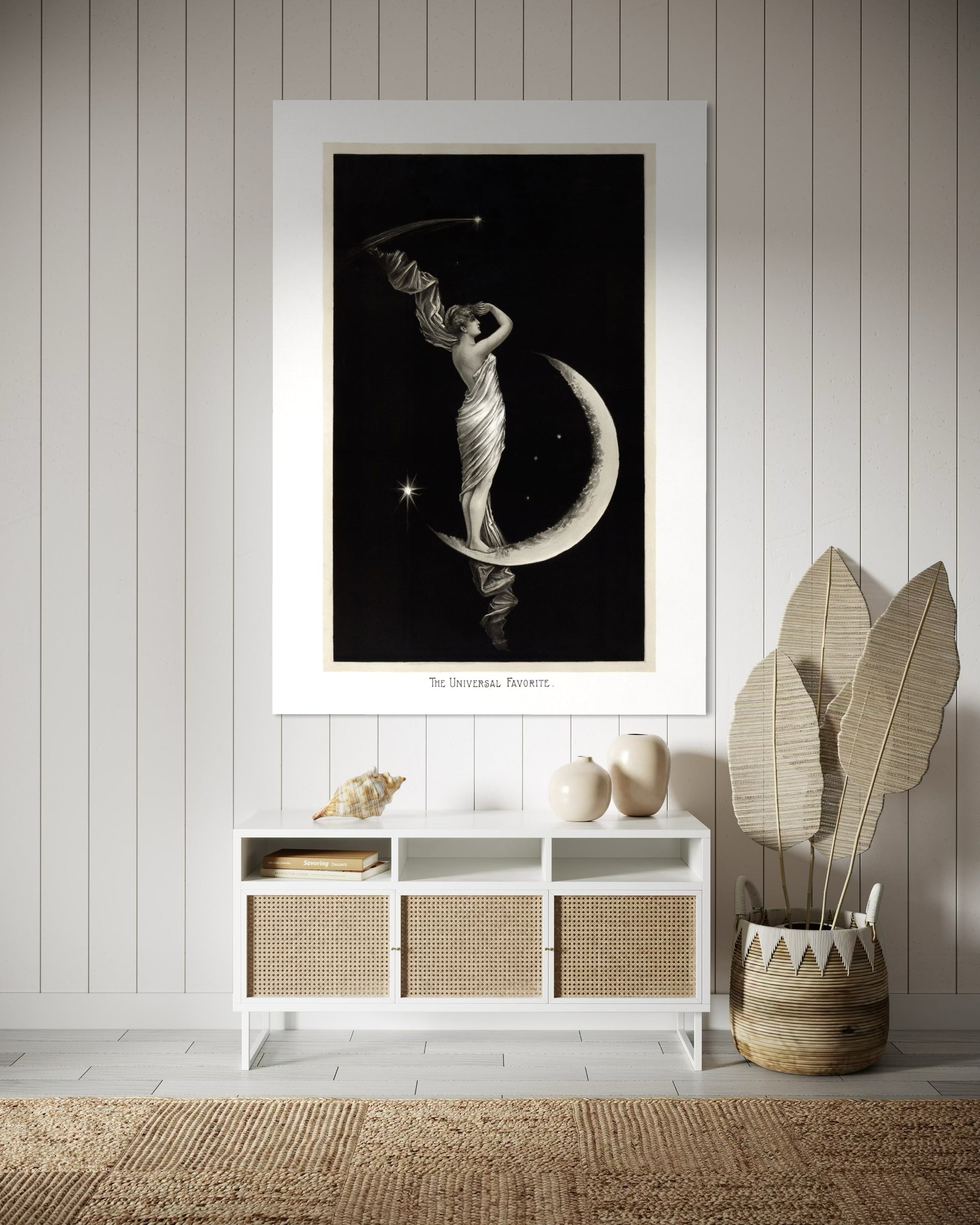 Universo incorniciato con sagoma femminile su luna nera, telaio bianco