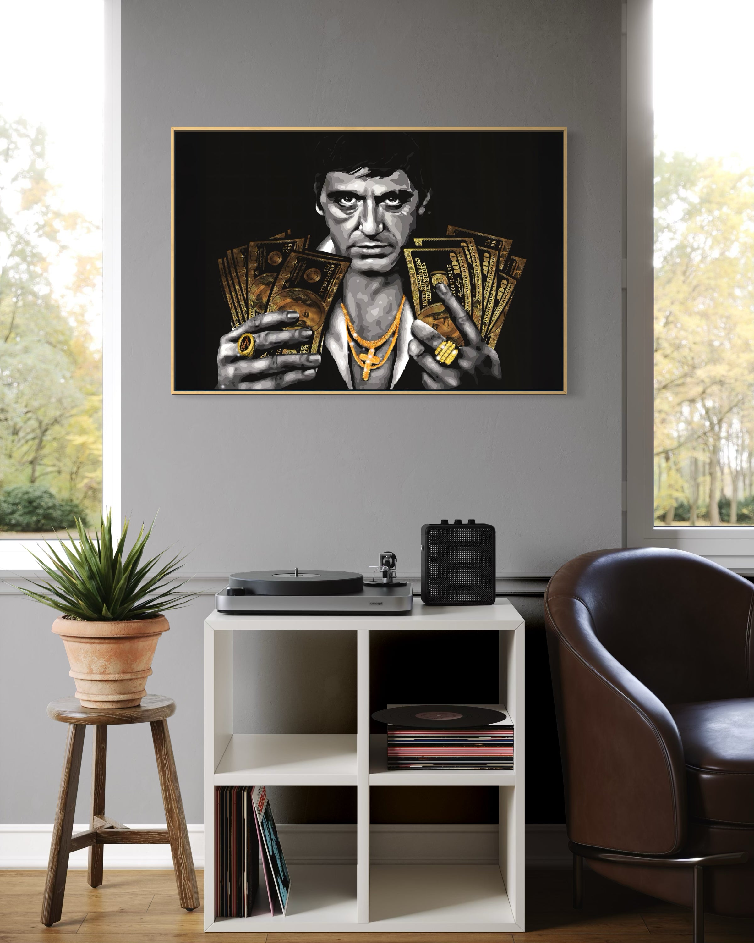 Quadro incorniciato con cornice oro e ritratto nero, uomo con banconote