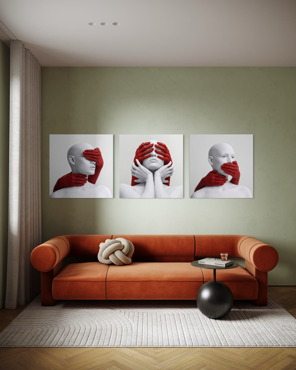 Trittico di stampe incorniciate con mani rosse e volto bianco, su parete