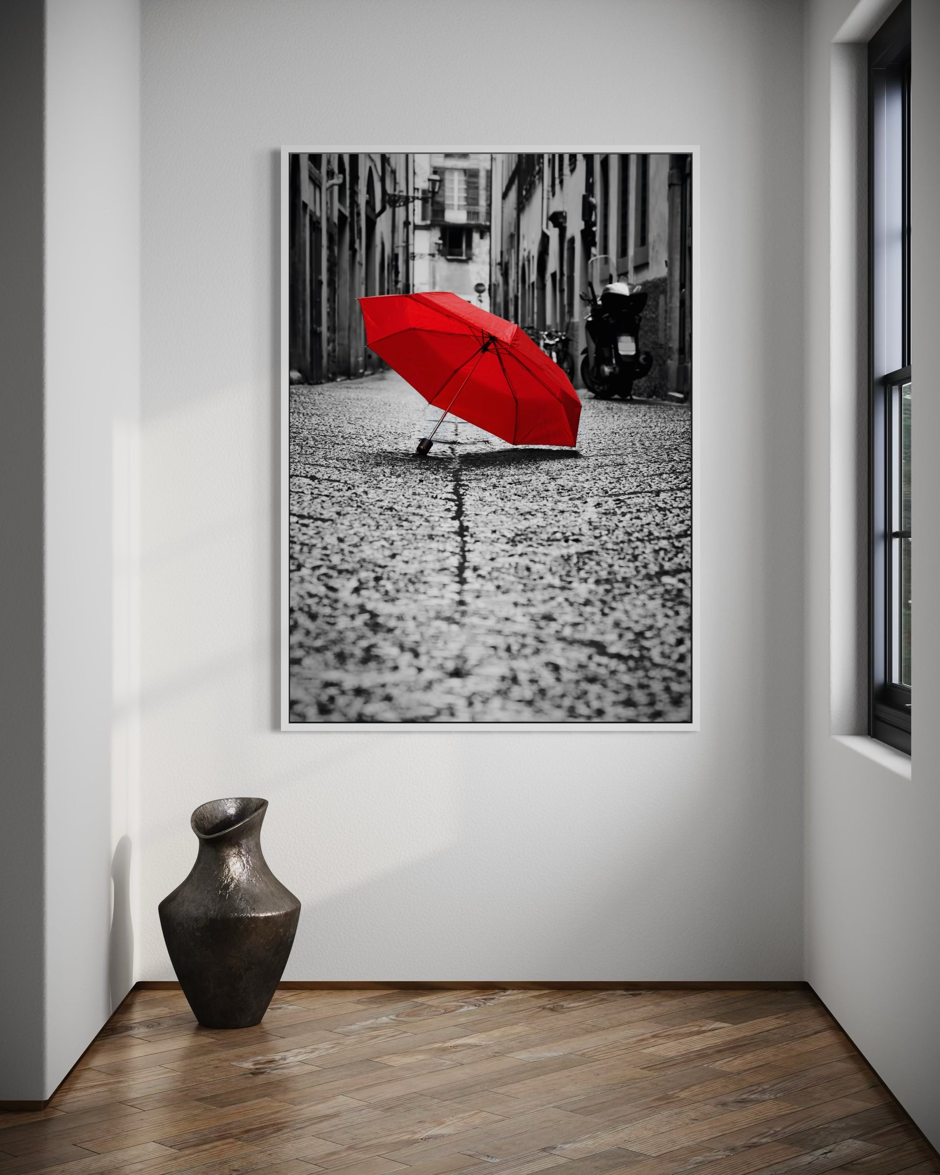 Red umbrella on wet street surface, closed canopy