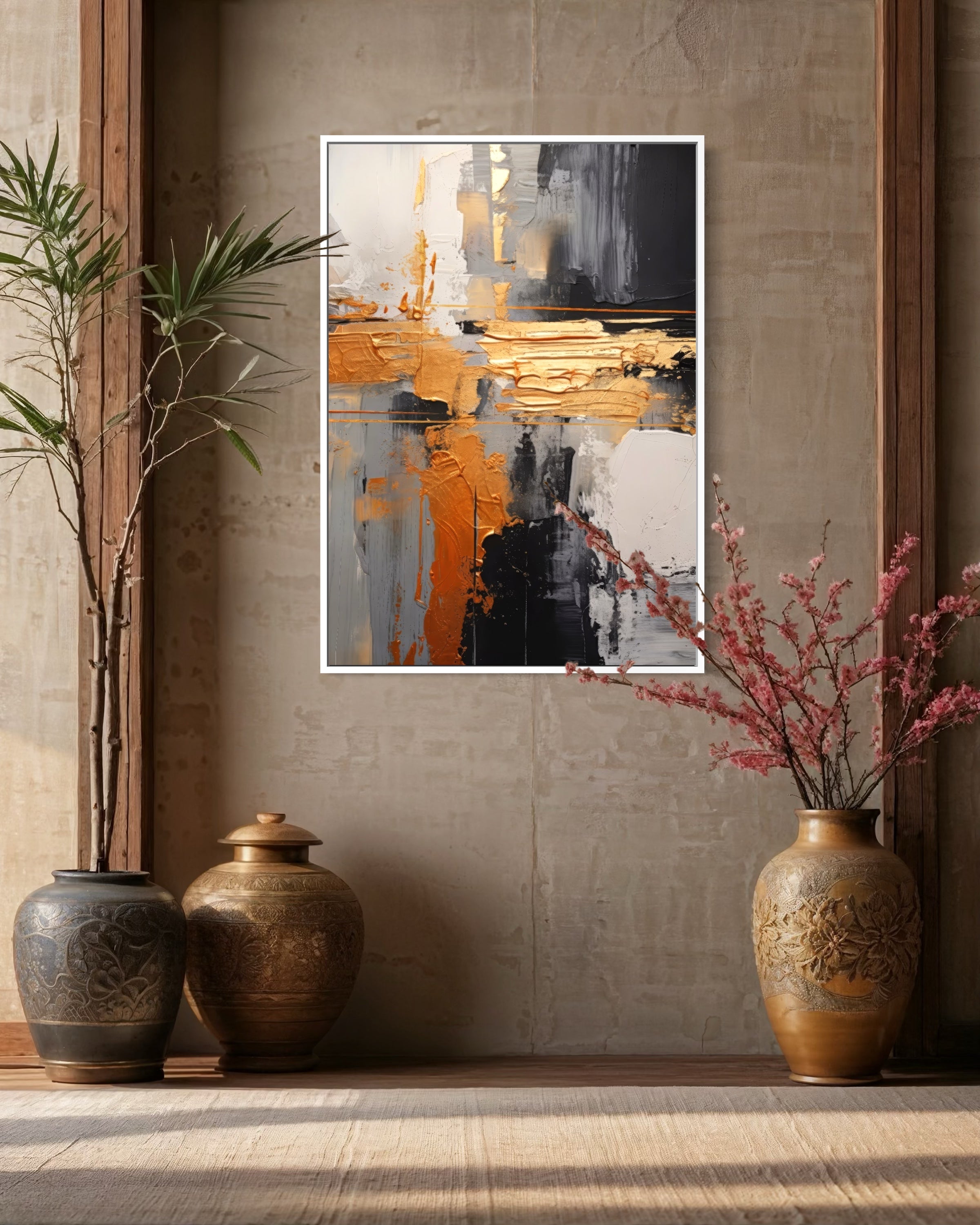 Quadro astratto con cornice bianca, pennellate oro, bianco e nero.