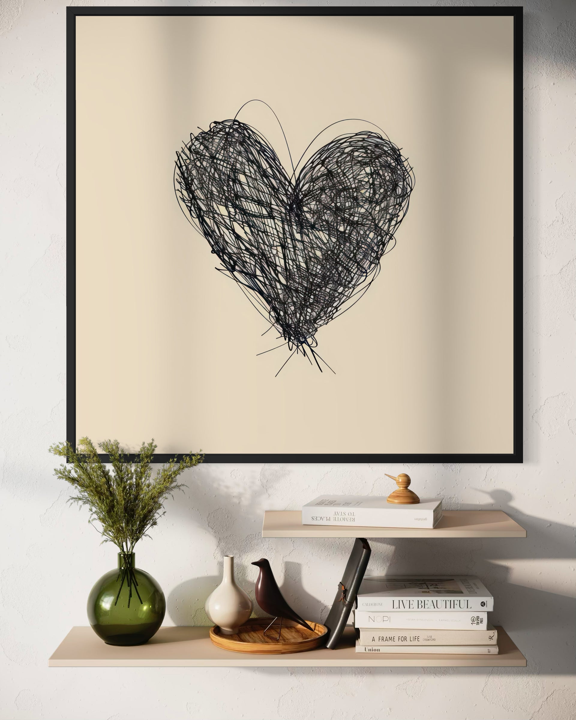 Amore confuso: cuore in filo nero in cornice nera